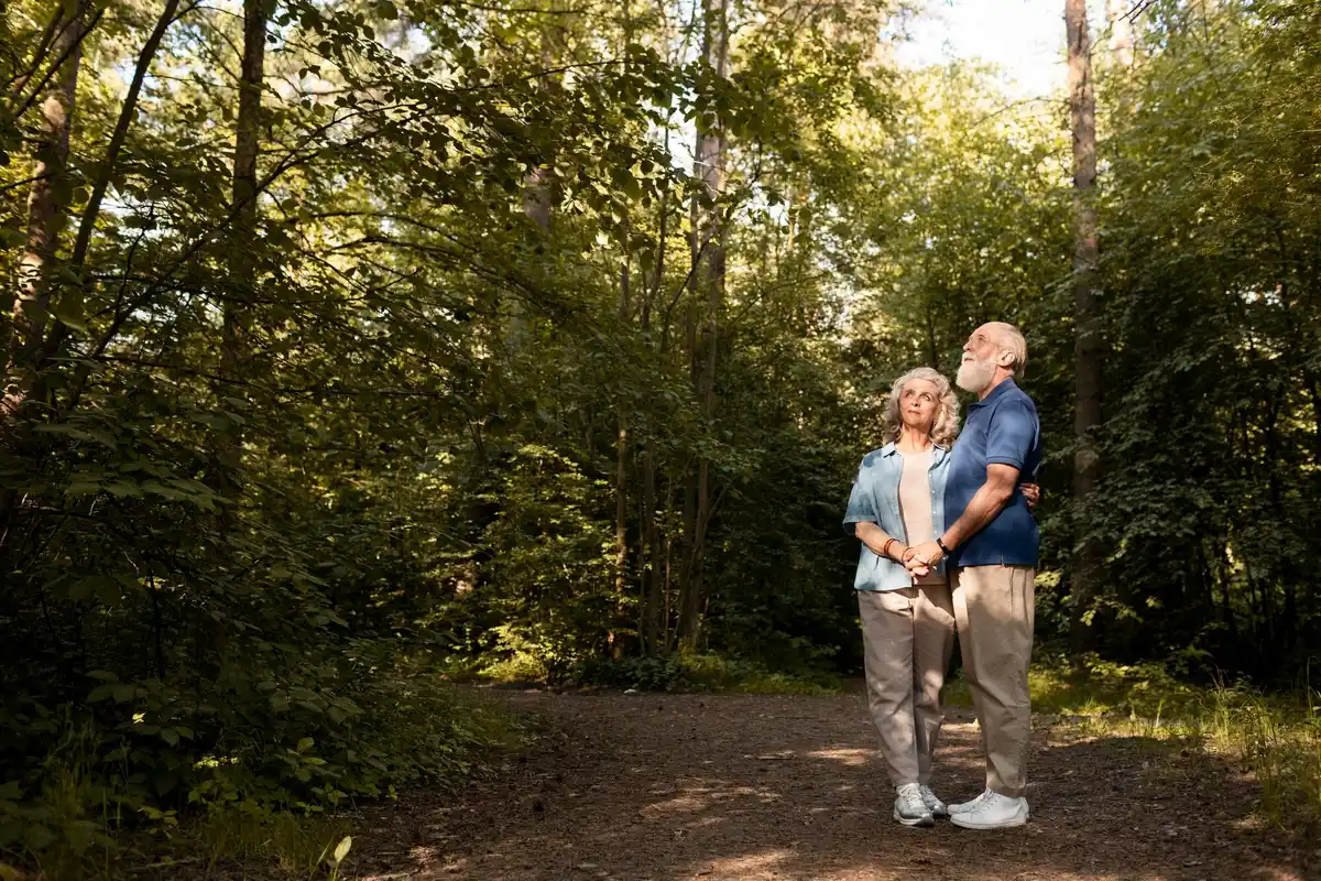 happy older Dutch couple walking together in nature