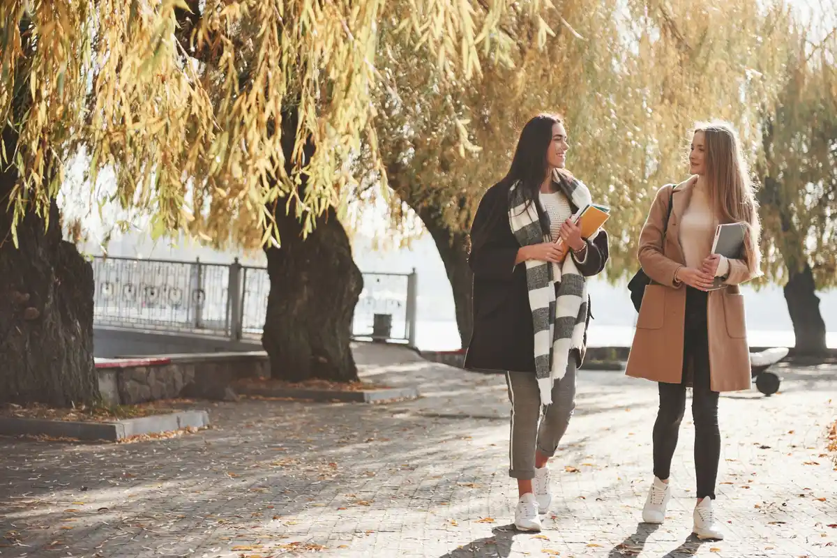 dutch people walking in urban park autumn