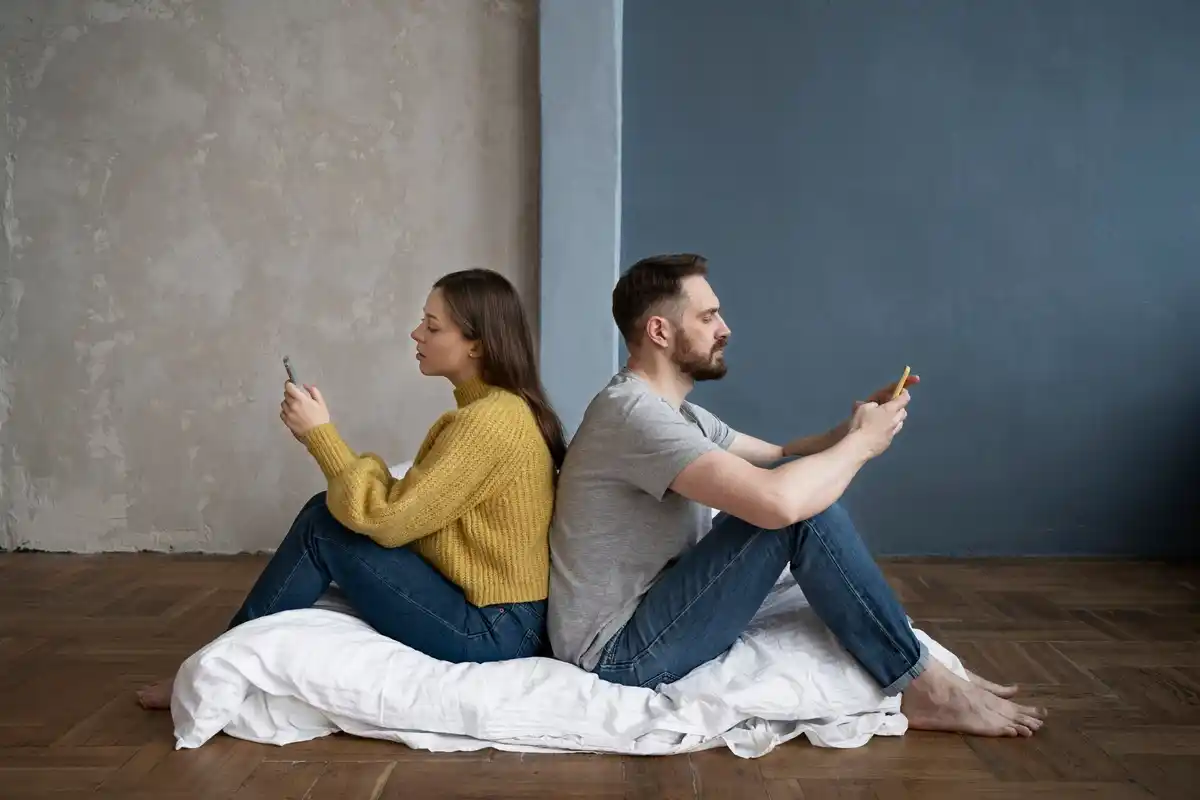 dutch couple ignoring each other at home, tense mood, everyday clothing, realistic