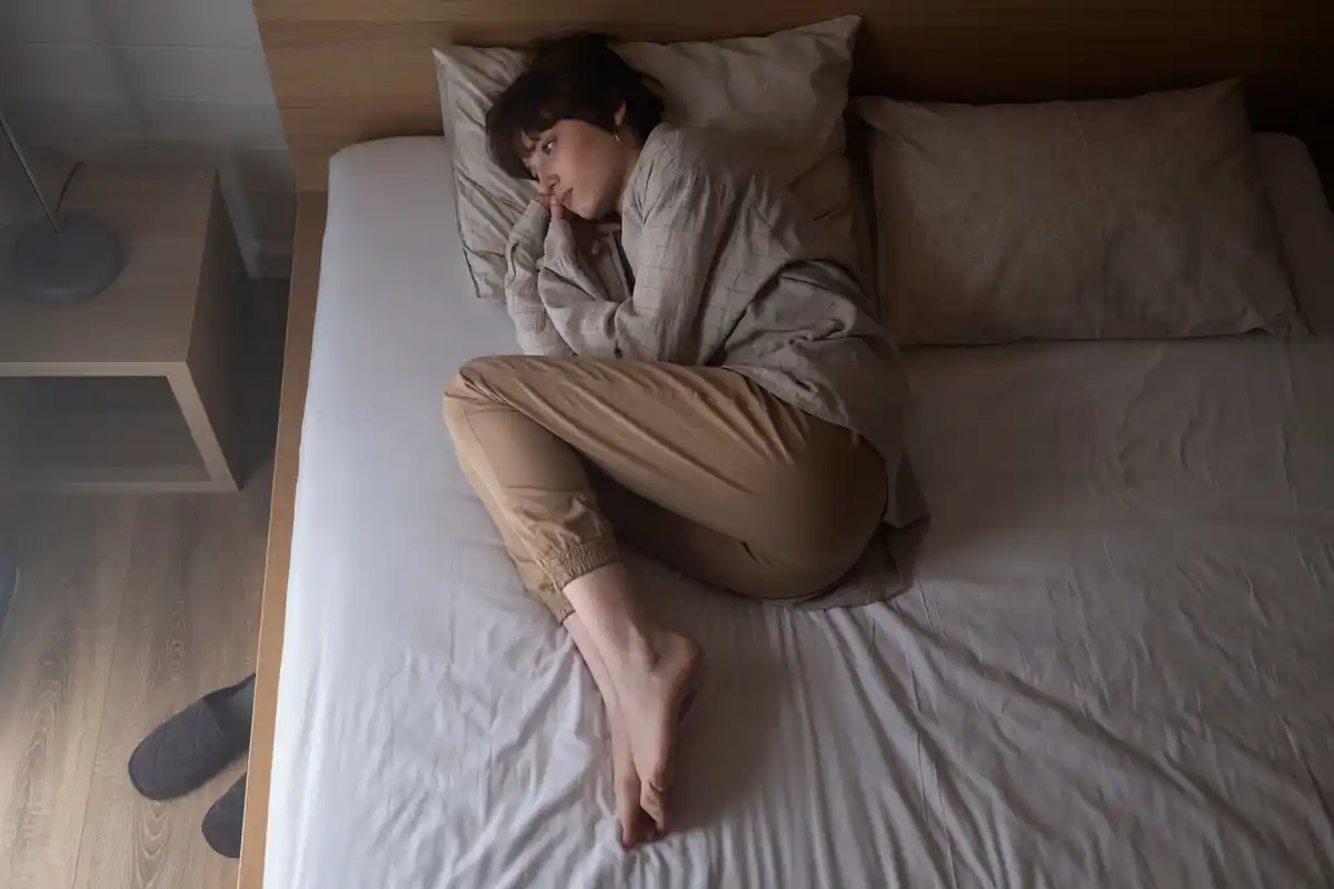empty half of the bed, one person alone at night, dutch bedroom, sad mood