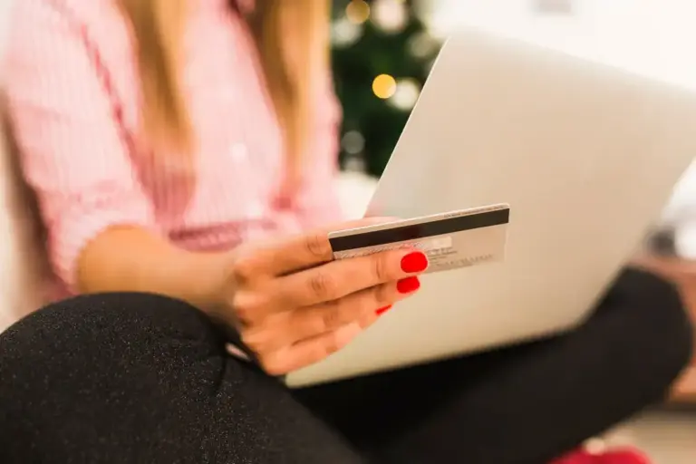 man using laptop booking hotel discount secret coupon code