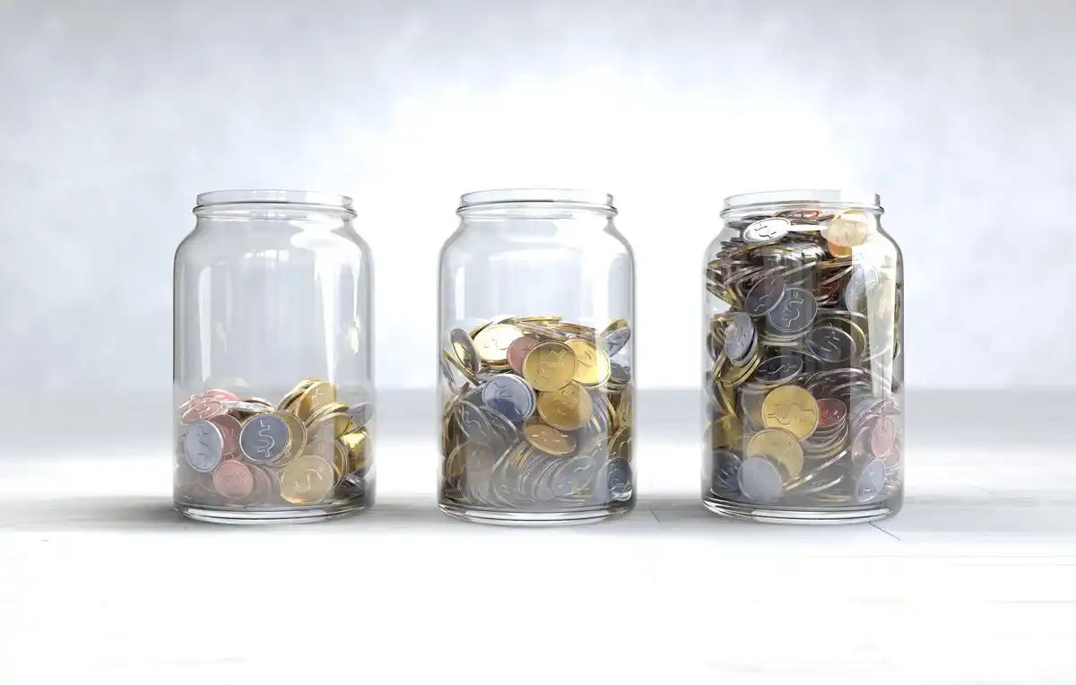 close up jar full euro coins on Dutch table