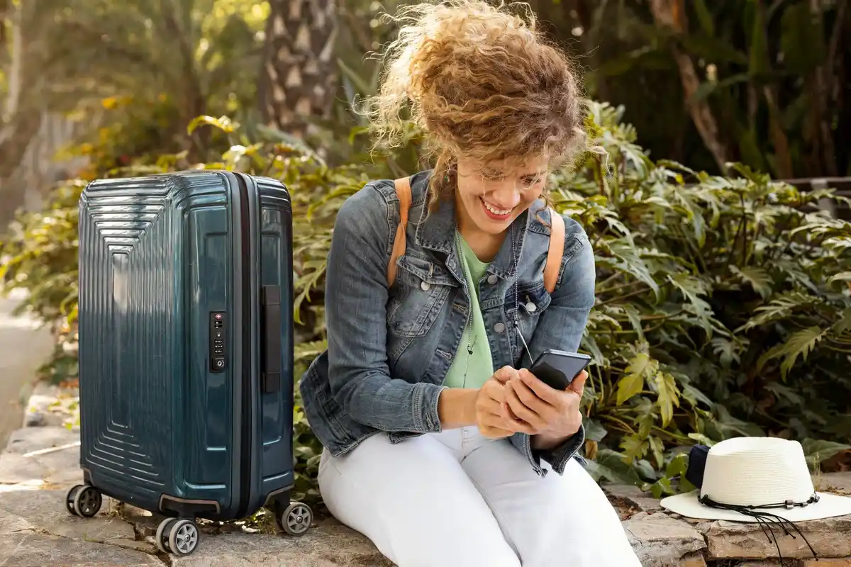 lightweight travel luggage Amsterdam woman packing clothes minimalism stylish