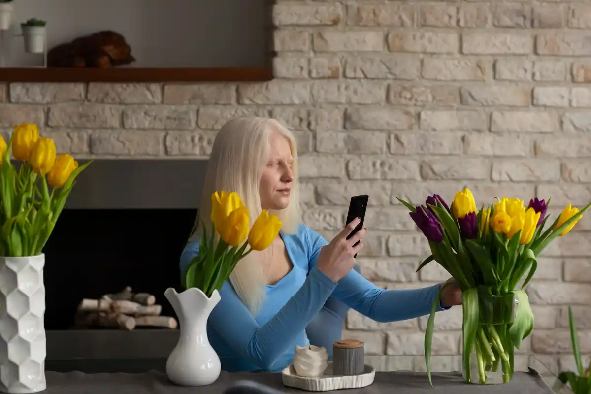 elderly woman using emergency phone settings indoor netherlands