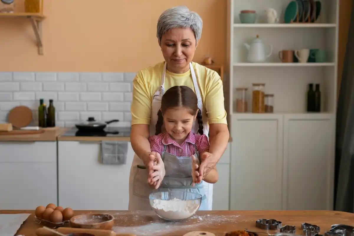 grandmother cooking with airfryer in traditional Dutch kitchen