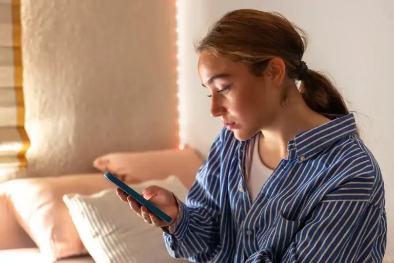 woman ignoring phone in calm morning dutch apartment
