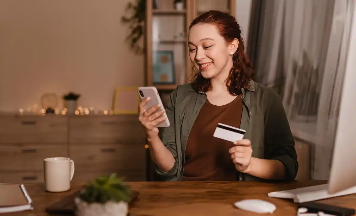 Dutch teenager using mobile banking app