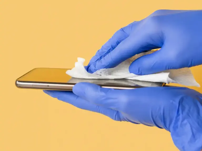 cleaning phone screen close up Dutch home