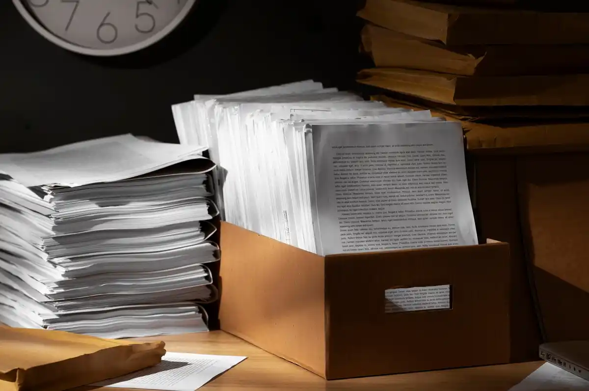 pile of old Dutch receipts on desk clutter personal finance