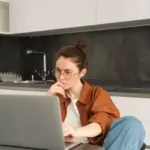Dutch person performing laptop maintenance at home
