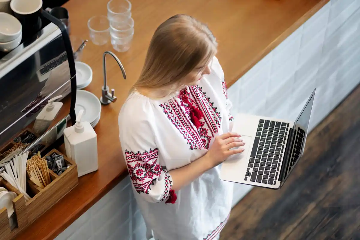 dutch person cleaning laptop keyboard lifestyle