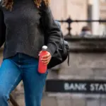 traveler filling reusable water bottle at airport Netherlands