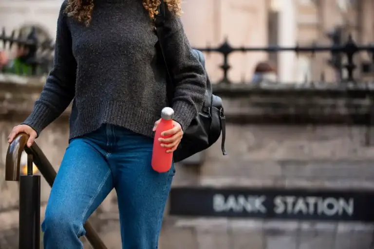 traveler filling reusable water bottle at airport Netherlands