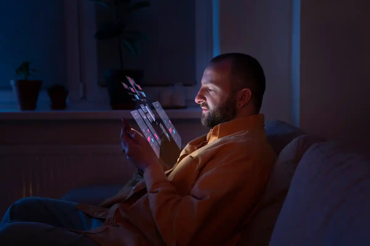 dutch person charging phone at night bedroom