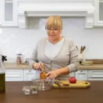 elderly dutch woman organizing modern kitchen
