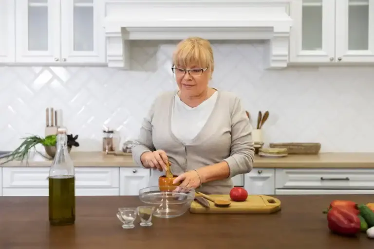 elderly dutch woman organizing modern kitchen