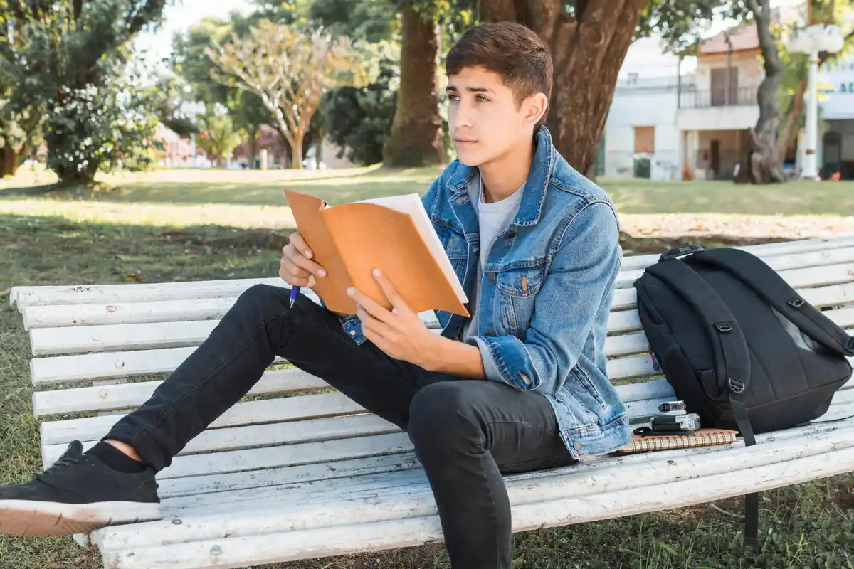 student studying outside no books no laptop