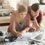 dutch family checking energy bill