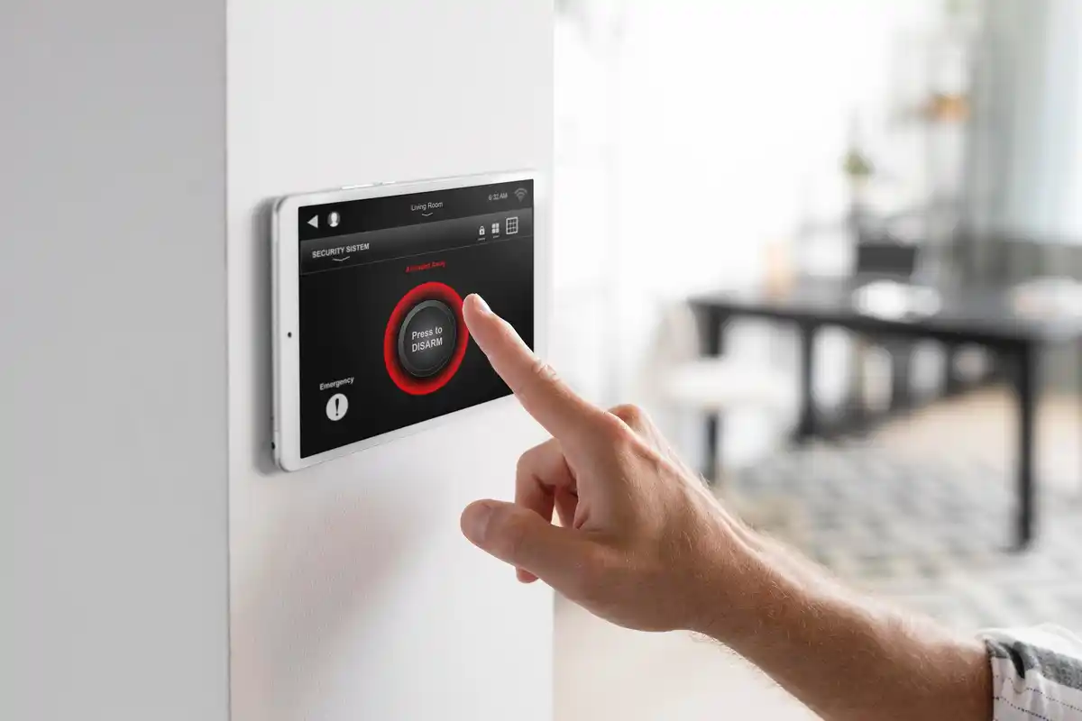 close-up hand turning down thermostat Dutch, home saving energy, modern thermostat