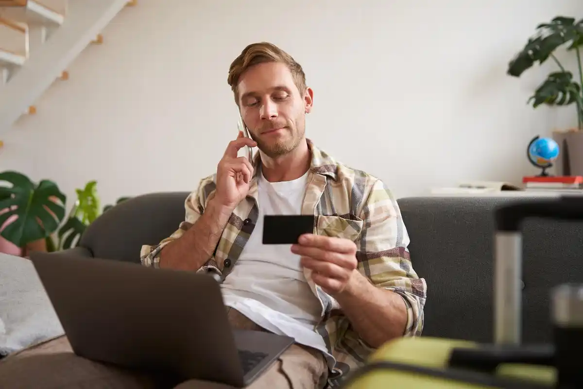 Dutch man checking bank statement on phone with a surprised face