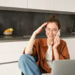 dutch multitasking stress brain damage woman kitchen phone laptop