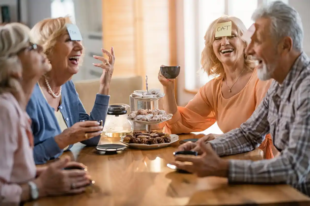 elderly Dutch friends laughing coffee park