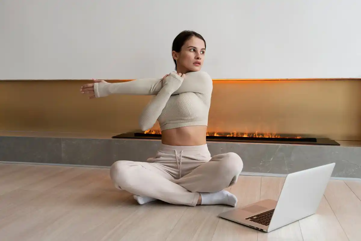 woman stretching on yoga mat, cozy home, relaxed mood