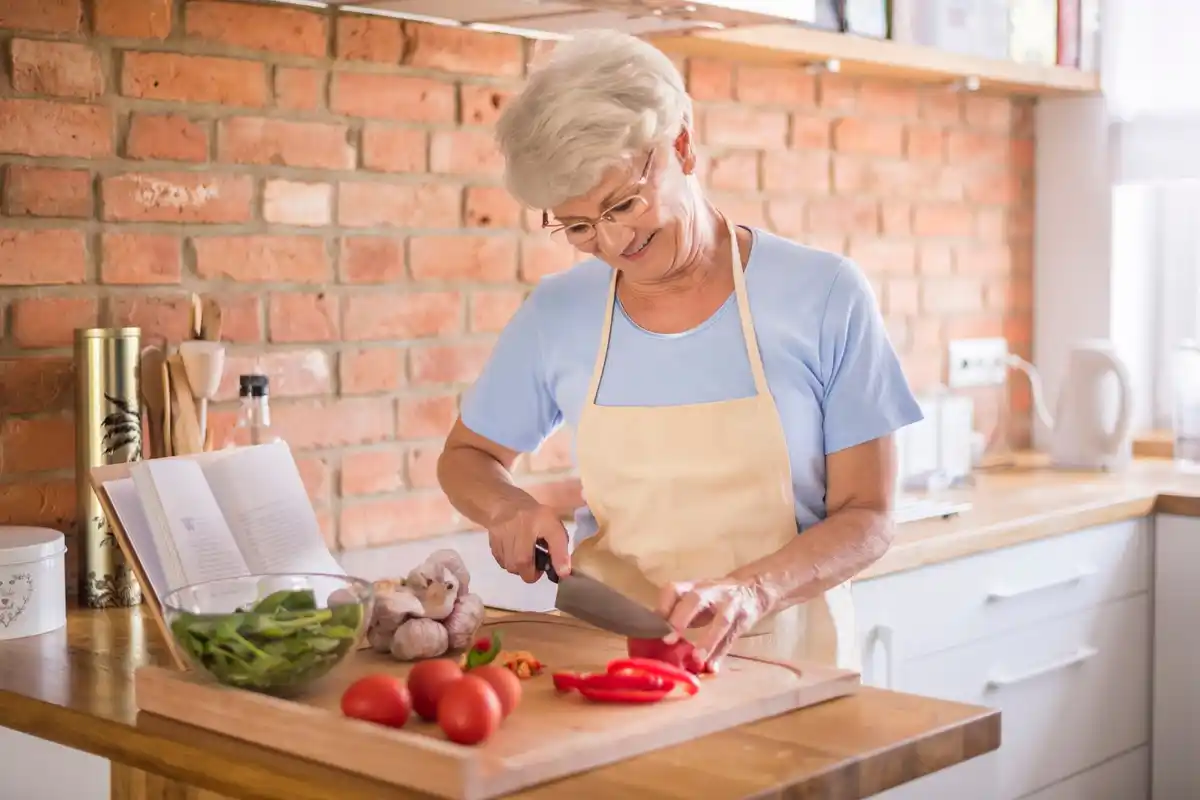 dutch grandmother cooking in old kitchen