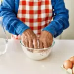 dutch grandma making pancakes in cozy kitchen