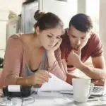 dutch couple planning finances at home