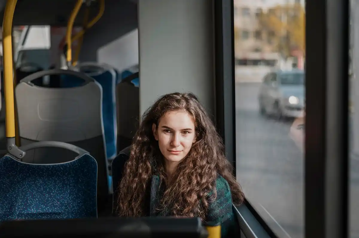 close up bare face woman public transport netherlands