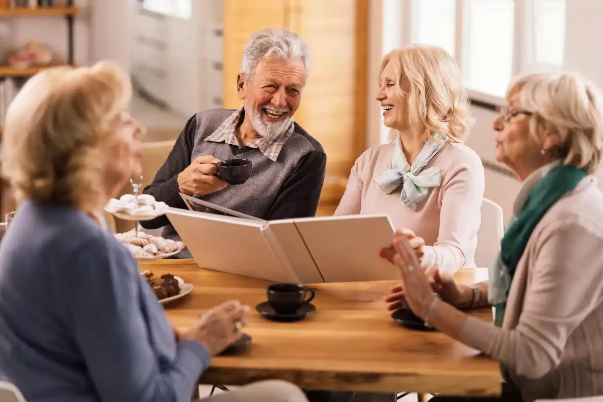 Group of Dutch seniors discussing bills kitchen table