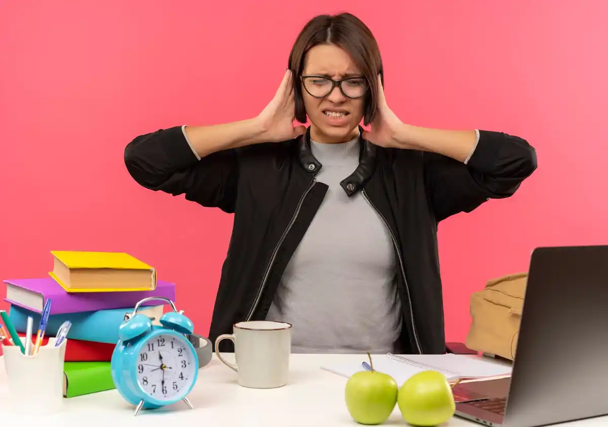 student multitasking desk stress