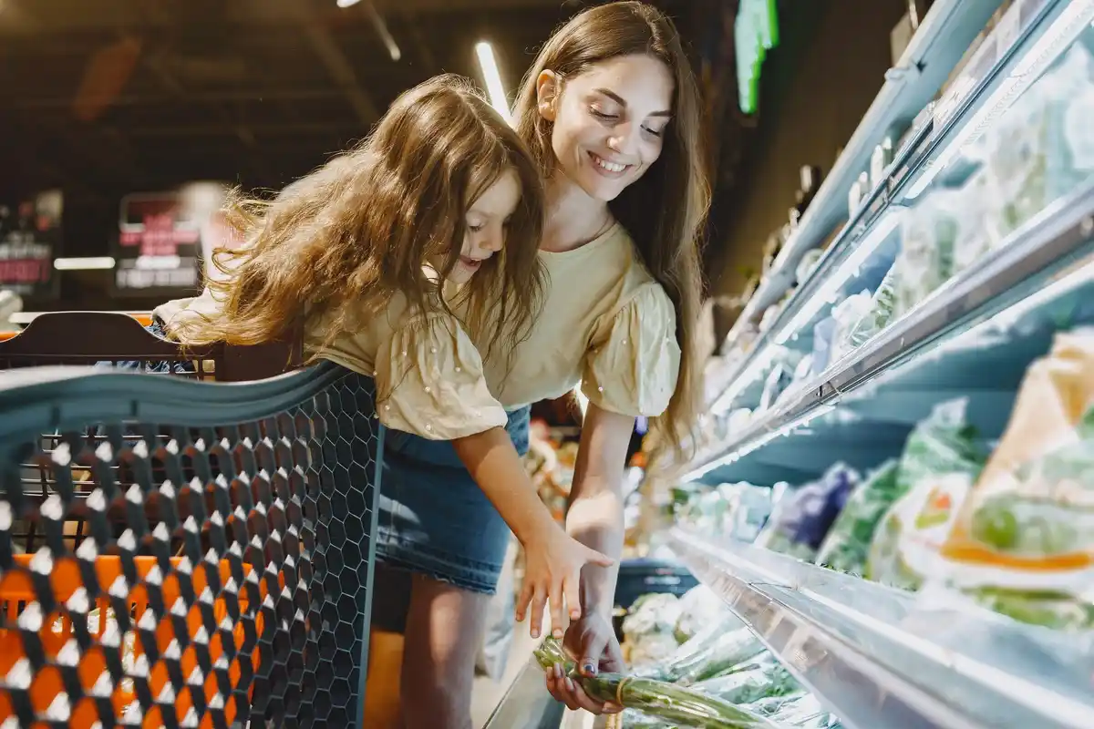 Dutch family shopping groceries in supermarket
