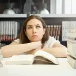 tired Dutch student studying library