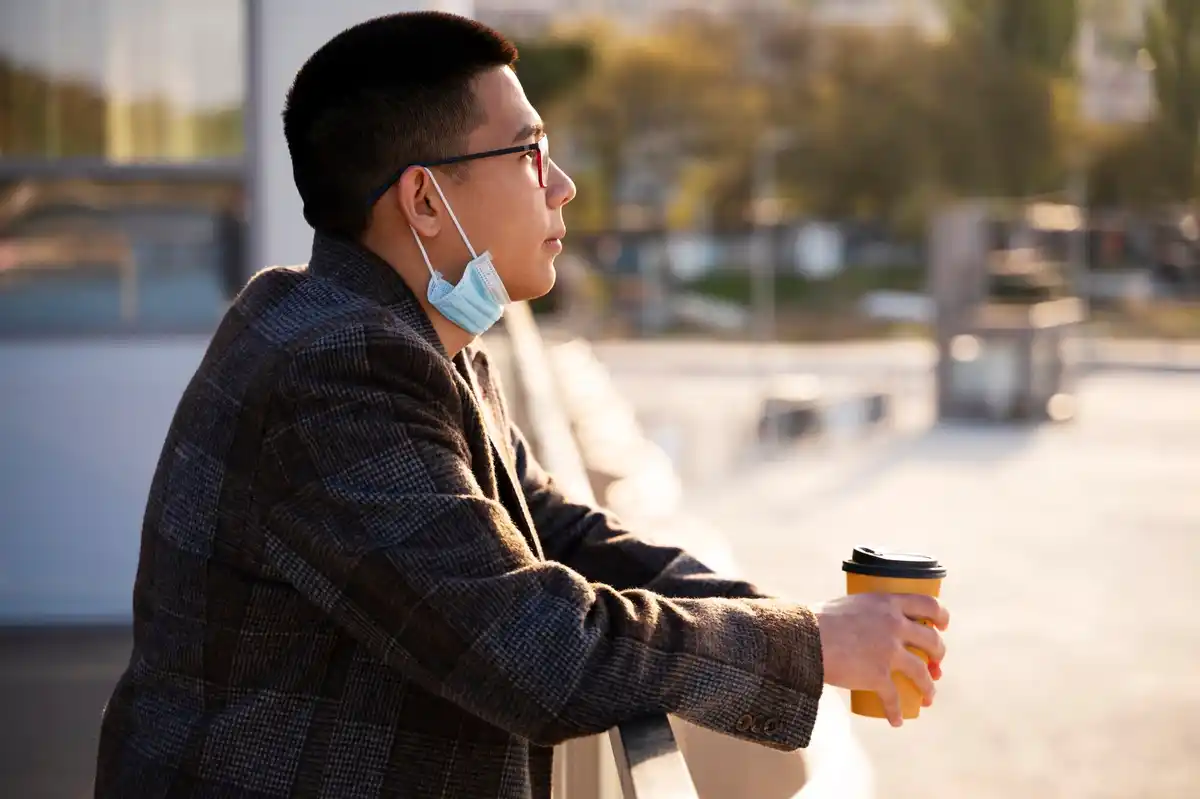 businessmen at Japanese airport sunlight sleep mask