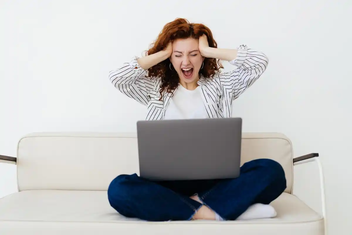 stressed person with slow laptop netherlands home office