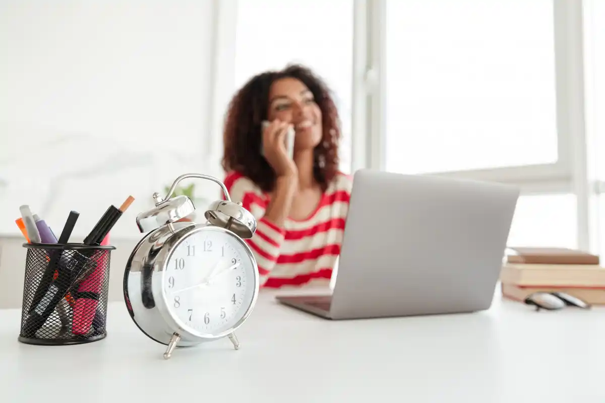 Timer on desk next to laptop working from home stress relief