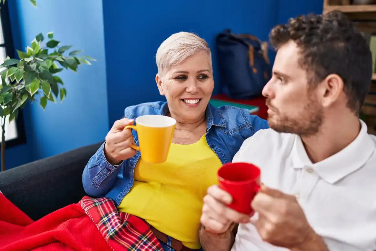 happy mature couple laughing together at home Netherlands