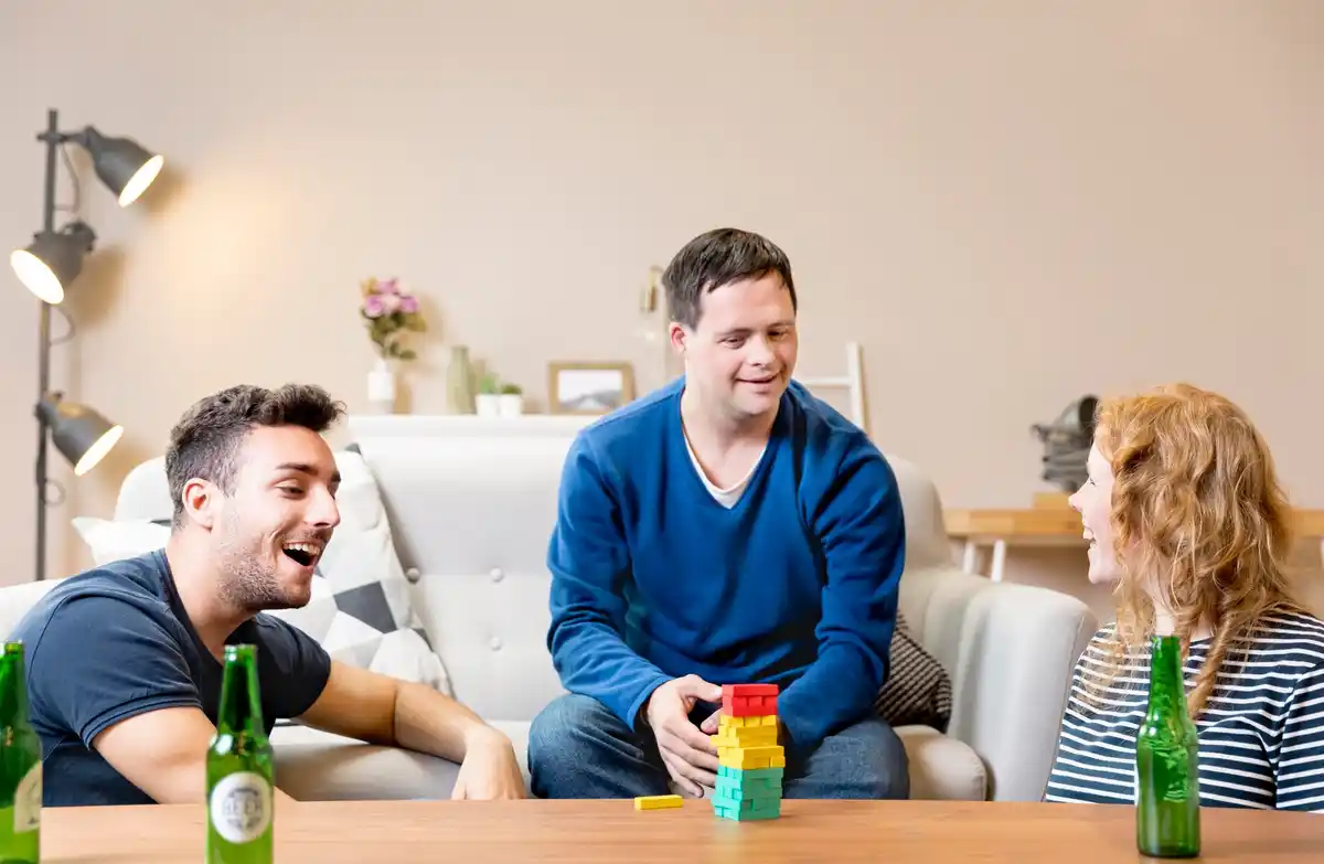 friends talking laughing living room Netherlands