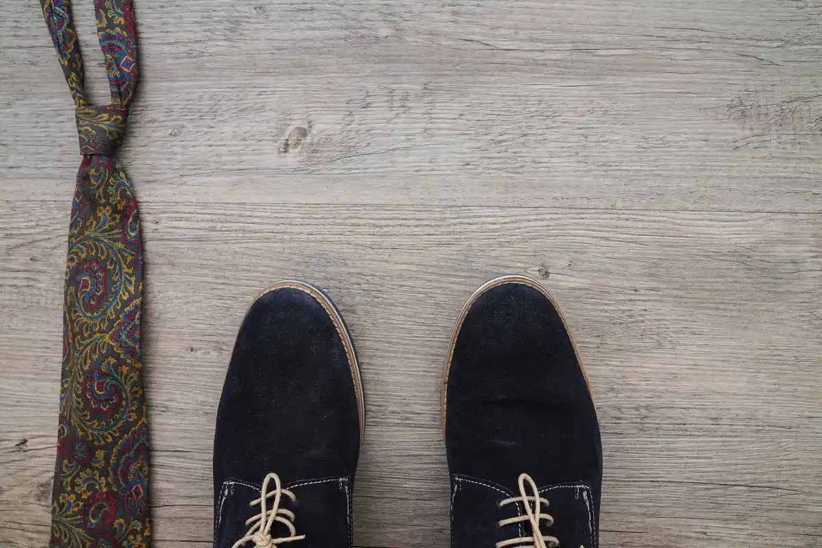 vintage sneakers on wooden floor close up
