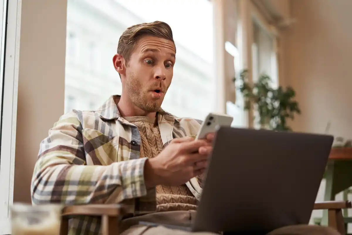 worried dutch man looking at online banking app netherlands