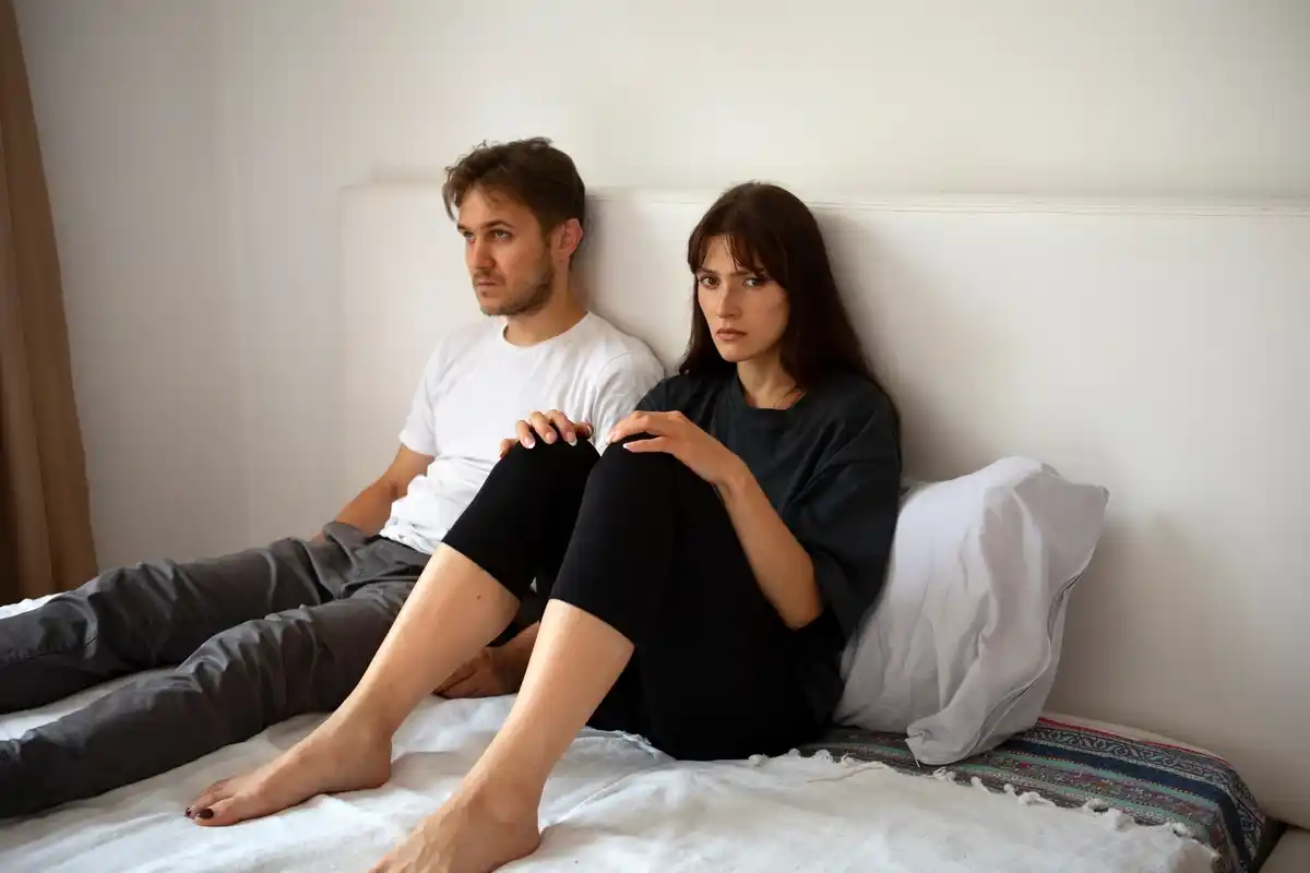 couple silently sitting together at home