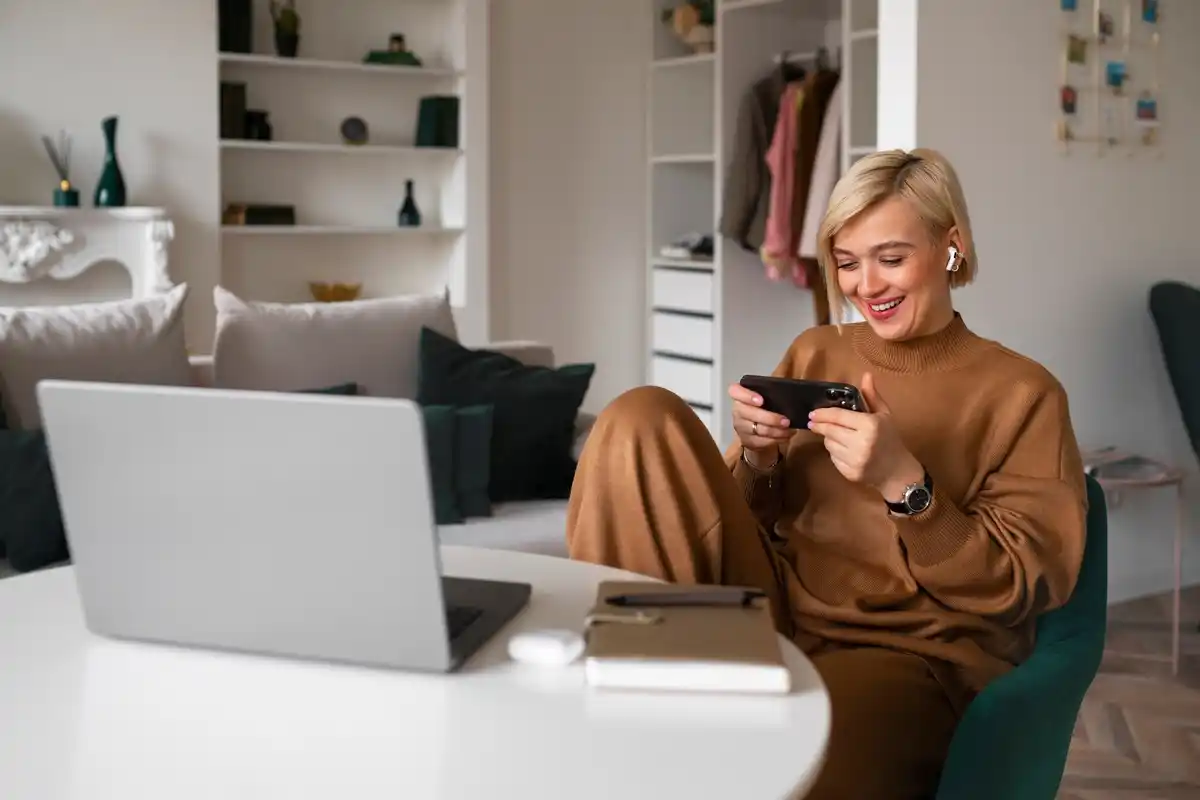 Dutch person using smartphone, saving money app, cozy home setting