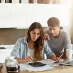 dutch middle aged couple budgeting money at home