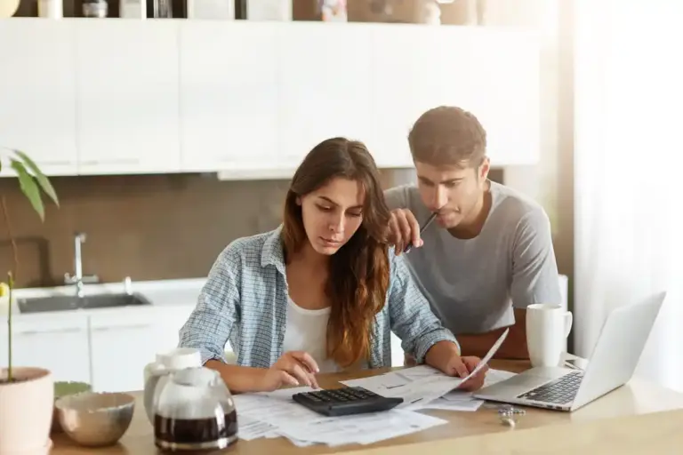 dutch middle aged couple budgeting money at home