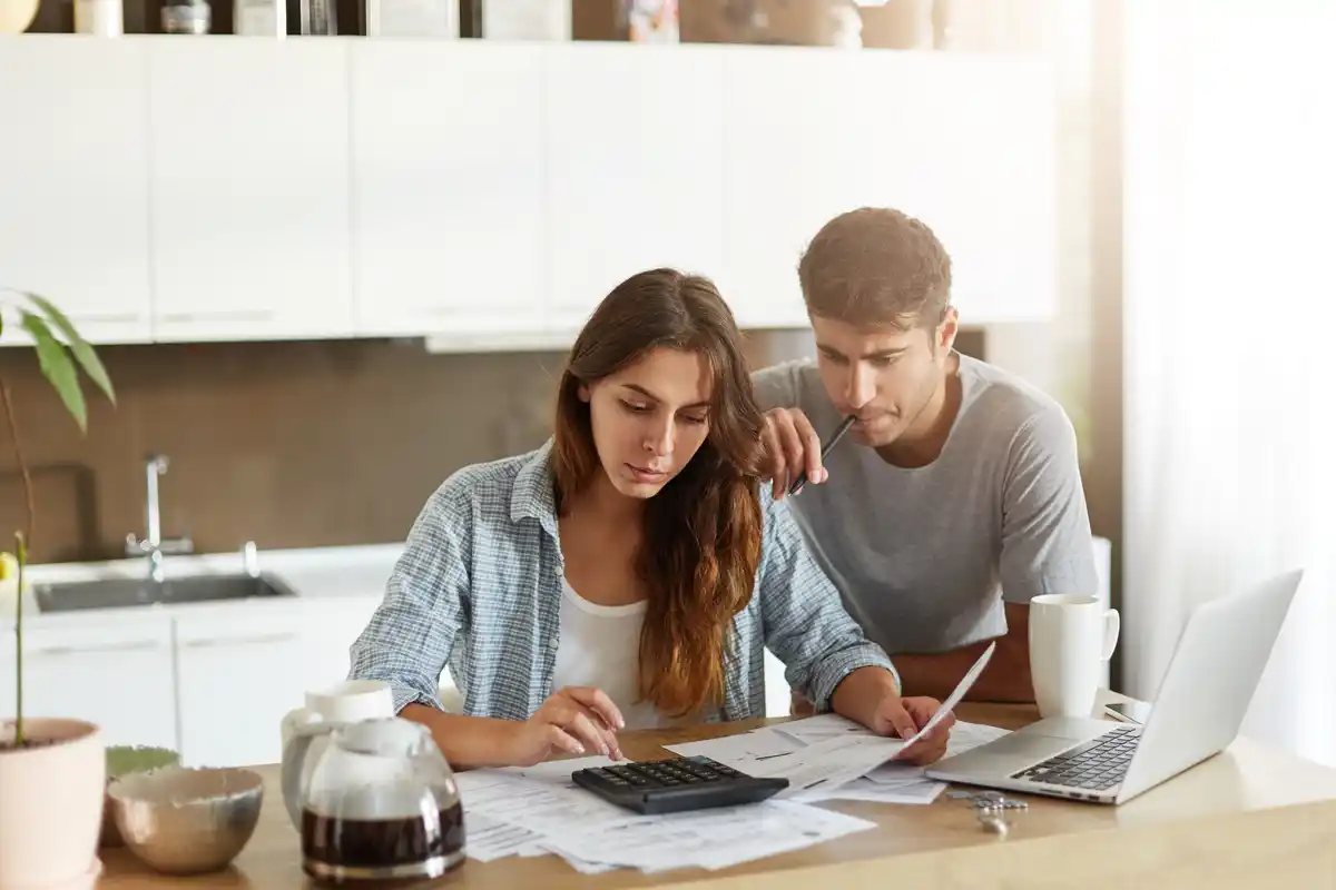 dutch middle aged couple budgeting money at home