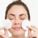 using toner with cotton pad vs hands skincare closeup