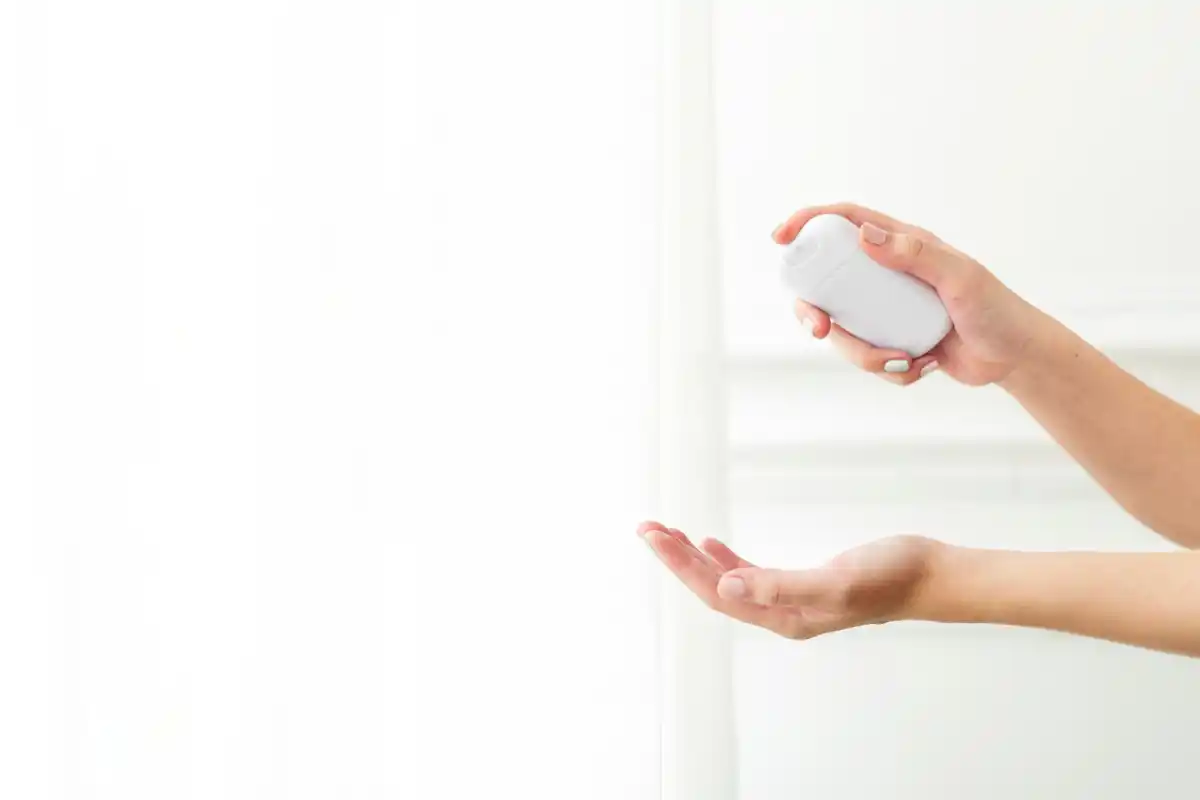 applying toner with hands minimalistic bathroom