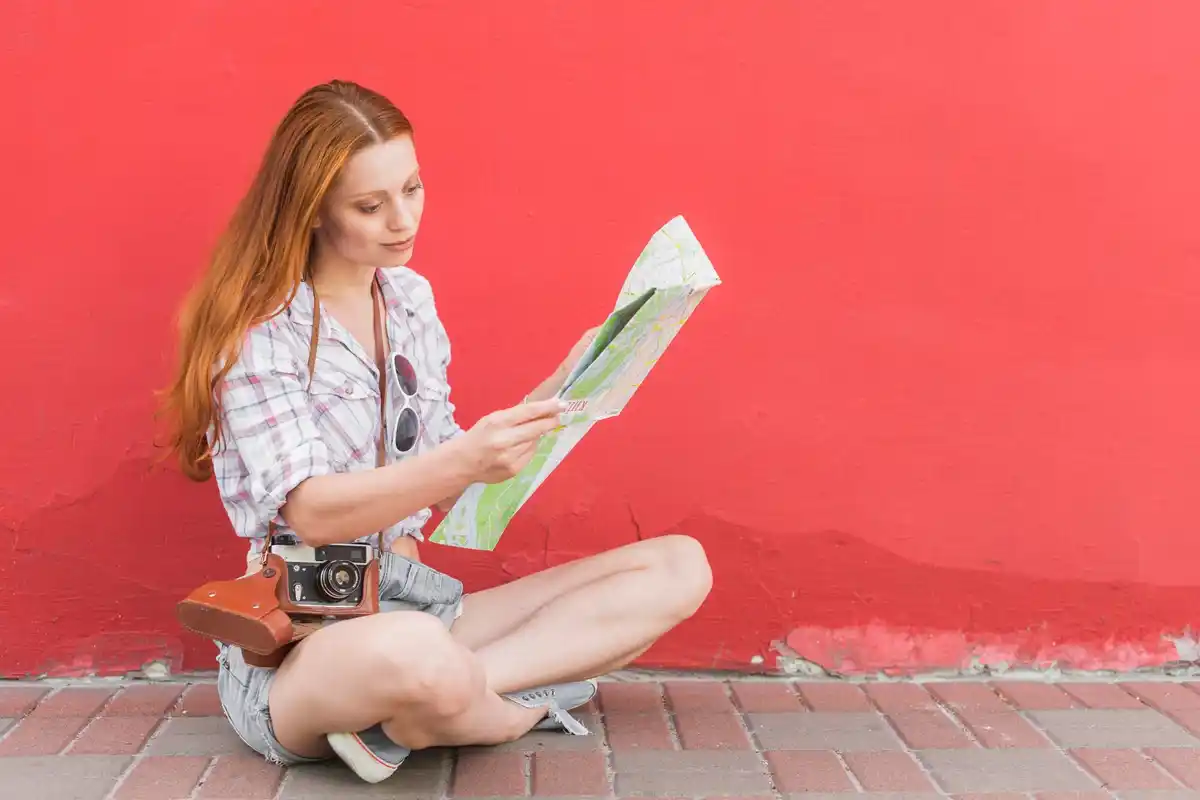 Dutch tourist using traditional paper map outdoors